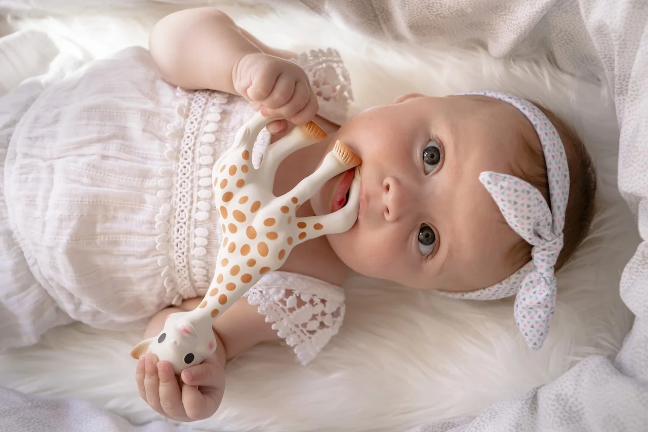 Sophie la girafe in use with the baby